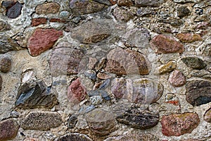 Close-up of a stone wall of an old castle in Dobele, Latvia