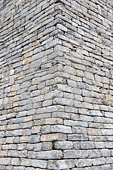 Close-up of stone wall use for construction business and designers. Stone backgrounds textured pattern abstract image.