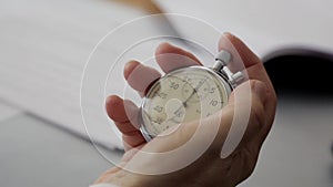 Close-up of a stopwatch in his hand