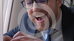 Close-up of a strange office worker looking at a PC screen. Funny business man