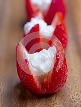 Close up of strawberries and whipped cream