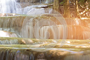 Close up stream waterfall in tropical deep forest