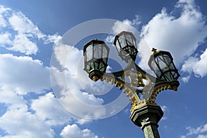 Street light against blue sky