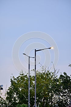 Close-up of the streetlight at the sunset, City light in the street with sky background.