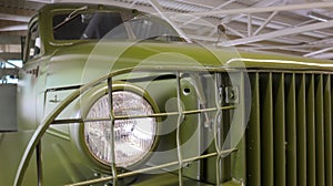 A close-up of the Studebaker US6 round headlight. Three-axle truck produced from 1941 to 1945. Increased cross-country ability and