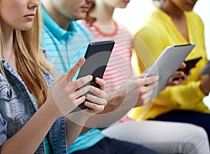 Close up of students with tablet pc at school