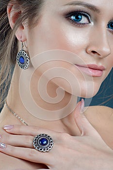 Close-up studio portrait model demonstrate stylish finger ring a
