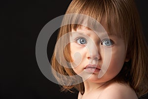 Close Up Studio Portrait Of Sad Young Girl