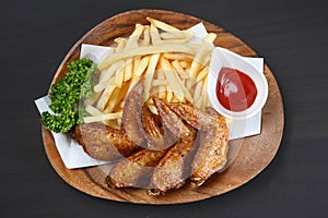 Fried chicken wings with french fries