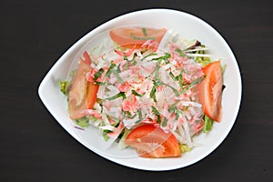 Close up studio shot of shrimp and radish salad