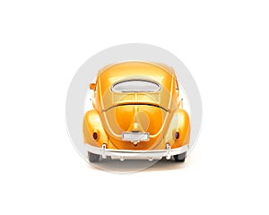 Close-up studio shot small orange toy car isolated on white