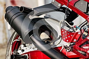 A close up of stunt motorcycle exhaust pipe