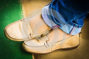 Close up of stylish female shoes. Outdoor fashion shoes footwear concept,Woman`s legs in blue jeans.