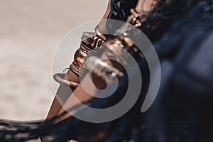 close up of stylish tribal dancer hands. woman in oriental costume outdoors