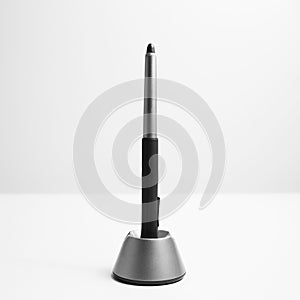 Close-up of stylus pen for graphic tablet on white background.