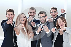 Close up. successful business team pointing at you