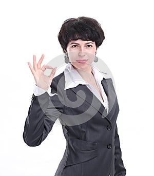 Close up. successful business woman showing OK gesture