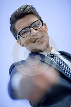 Close up. successful businessman pointing his finger at you