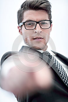 Close up.successful businessman pointing his finger at you