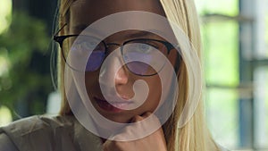 Close-up successful businesswoman Caucasian girl in glasses tempting looking at camera business portrait of confident