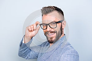 Close up of successful young handsome brunet bearded businessman