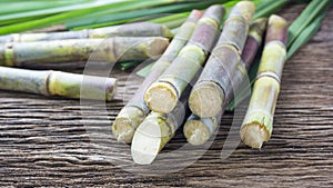 Close up sugarcane on wood background close up.