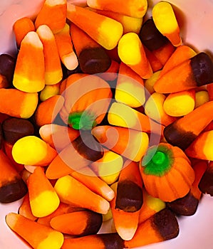 Close-up of sugary sweet candy corn, with its distinct tri-colored layers.