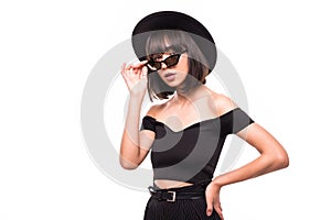 Close up sunny portrait of beautiful woman with fluffy hat brunette, smiling, having fun on the white wall