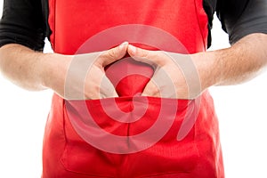 Close-up of supermarket employer with hands in pockets