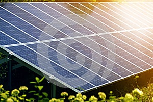Close-up surface of lit by sun modern saving efficient stand -alone blue shiny solar photo voltaic panels system producing