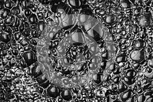 Close up of the surface of obsidian or black volcanic glass