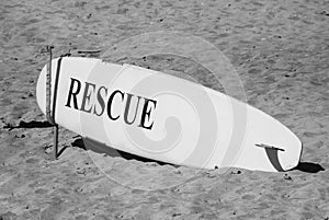 Close-up of a surfing board on the sand at the beach