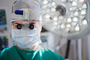 Close-up of surgeon wearing surgical loupes