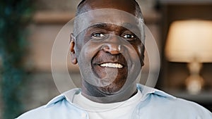 Close up surprised male portrait amazed face American African adult man 60s senior businessman grandfather standing at