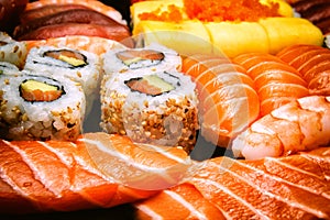 Close-up on sushi, sashimi and california rolls