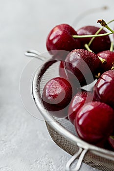 Close up sweet cherry in strainer