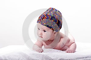 Close-up of sweet little newborn baby face with stocking cap