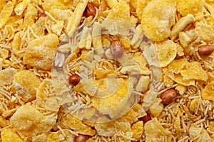 Close-up of Sweet and Salty Cornflakes Mixture Indian namkeen (snacks) Full-Frame Background.