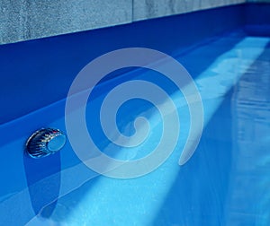 Close up of swimming pool pavers and lighting system