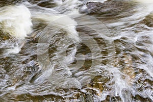 Close up of the swirling water of Eller Beck, Skipton