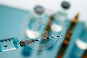 Close up Syringe needle medicine with liquid medicine drop