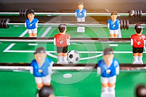 Close-up of Table football soccer game on green field