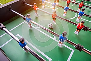 Close-up of Table football soccer game on green field