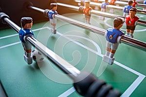 Close-up of Table football soccer game on green field