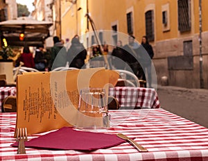 Close-up on a table of an outdoor Italian restaurant photo