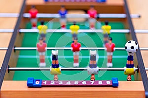 Close up table soccer with players and a ball