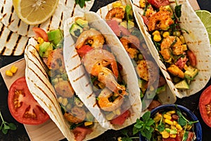 Close up tacos with shrimp. Mexican traditional snack. View from above.