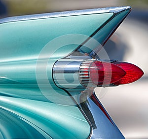 Close up, tail fin and lights of American classic car.