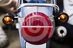 Close up taillight on old dirty vintage motorcycle