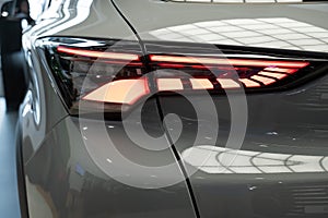 Close-up of the taillight of a white modern car.